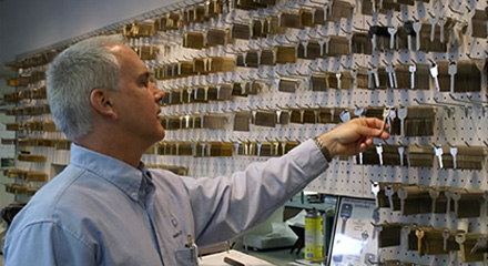 Jim Riddle holding keys at Anderson Lock.