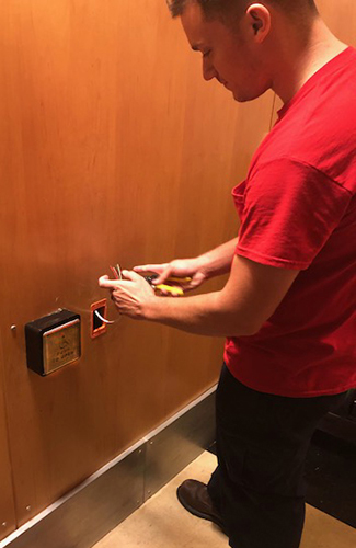 Anderson Lock Employee installing security locks