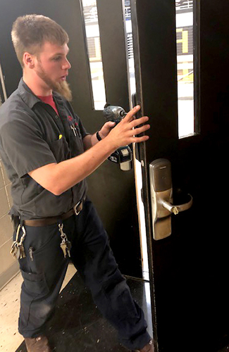 Anderson Lock Employee installing security locks